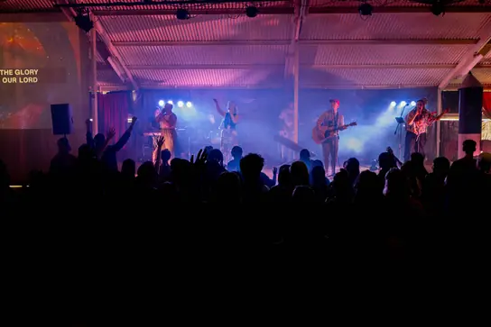 A band playing to a packed hall